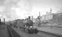 Ex-GNSR no 49 Gordon Highlander runs through Haymarket with the special 9am Glasgow Central - Leith Central via Shotts on 19 April 1965. The train was part of <I>Scottish Rambler No 4</I> and would later join up with a second train hauled by ex-CR 123 at Carstairs [see image 20513] before the combination returned west to end the tour at Glasgow Buchanan Street.  <br><br>[K A Gray 19/04/1965]