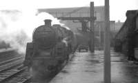 A cold, wet, January morning at Carlisle in 1965. Corkerhill's BR Standard class 5 4-6-0 no 73122 awaits its deparure time from platform 3 with the 11.00 for Glasgow St Enoch.<br><br>[K A Gray 23/01/1965]