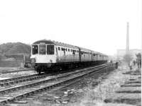 The Rossendale Farewell railtour pulls into Rawtenstall marking full closure of the line nearly nine years after passenger services had ceased. The coal depot behind the train was still operating but the coal train had gone from daily to thrice weekly and then <I>as required</I> before ceasing altogether. [See image 32156] for the same location thirty years later.<br><br>[Mark Bartlett 14/02/1981]