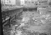 Reconstruction work on the uncovered Glasgow Central Low Level station underway in 1974. Argyle Street runs past on the left behind the hoardings.<br><br>[John McIntyre //1974]