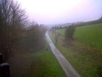 The Great Western Railway's former Frome to Bristol line seen running towards Hallatrow. Viewed from the Five Arches S&D viaduct near Radstock on a hazy 28 December 2010. Notice the old signal post to the right of the trackbed.<br><br>[Ken Strachan 28/12/2010]