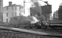 BR Standard class 4 2-6-4T no 80000 taking water outside St Enoch in October 1965.<br><br>[K A Gray 20/10/1965]