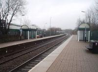 New Year's morning at Church and Oswaldtwistle, looking towards Accrington. Just beyond the end of the platforms was the entrance to Accrington Motive Power Depot, which only finally closed to DMUs in the early 1970s. The buildings behind the far platform occupy the site of the old goods yard. [See image 30519] for a view of the original goods shed and the predecessor waiting shelter.<br><br>[Mark Bartlett 01/01/2011]