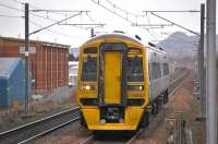 158867 nears Edinburgh Park station with a Dunblane service on 5 January 2011.Arthur's Seat dominates the background.<br>
<br>
<br><br>[Bill Roberton 05/01/2011]