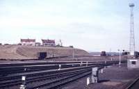 Hump shunting taing place at Perth New Yard on 25th March 1963, not long after this product of BR's 1955 Modernisation Plan had opened for business. Like many aspects of the latter, it was soon overtaken by events - in this case not just the general loss of wagonload business to the road haulage industry, but also specifically the closure of the Strathmore Line through Forfar in 1967, which meant that (other than the surviving freight stub to Forfar) the only freight traffic passing the New Yard was for Inverness. [See image 21446]<br><br>[Frank Spaven Collection (Courtesy David Spaven) 25/03/1963]