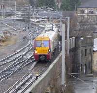 Wallneuk Junction is immediately to the east of Paisley Gilmour Street station and is where the Inverclyde lines part company from the Glasgow & Paisley line. On 4 January 334 021 sticks to the Ayrshire line with a service for Ayr, and will call at Platform 4 at Gilmour Street.<br>
<br><br>[David Panton 04/01/2011]