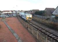 Plasser & Theurer tamper DR73914 <I>Robert McAlpine</I> runs past Barassie heading for Kilmarnock on 7 January 2011. It had arrived from the Irvine direction and reversed in the holding sidings.<br><br>[Ken Browne 07/01/2011]