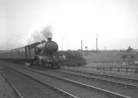 V3 67636 with empty stock from Heaton CS for the <I>Durham Rail Tour</I> of 13 October 1962. After crossing the King Edward Bridge and run east to reach Pelaw the train has turned south under the A184 road on the 'old main line'. This will take it through Washington and Leamside to reach Durham, the starting point for the railtour.<br><br>[K A Gray 13/10/1962]