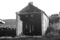 The former locomotive shed at Rothbury, terminus of the Northumberland Central Railway branch running north from Scotsgap. Photographed during a visit by the <I>Wansbeck Wanderer</I> railtour in November 1963.<br><br>[K A Gray 09/11/1963]
