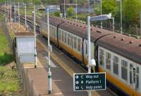 Platform scene at Salfords station in May 2005 with a slamdoor 4 VEP unit bound for Gatwick Airport.<br><br>[Ian Dinmore 17/05/2005]