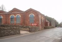 The Rothesay Tramways depot in Port Bannatyne used to house twenty electric tramcars, and is still in use as a bus depot. The trams ceased operating in 1936 but Rothesay buses were labelled <I>Rothesay Tramways</I> until the 1950s. This is a view of the depot looking north on the road from Rothesay to the Colintraive ferry and the trams ran along this road past the depot before accessing a dedicated route across the island to Ettrick Bay. [See image 32657].<br><br>[Mark Bartlett 28/12/2010]