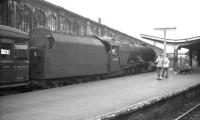 Stanier Princess Pacific no 46208 <I>Princess Helena Victoria</I> runs past a pair of admirers and into Carlisle platform 1 on 4 August 1962 with the 9.20am Crewe - Aberdeen train.<br><br>[K A Gray 04/08/1962]