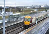 The 11.57 service to Helensburgh Central (11.21 ex-Edinburgh Waverley) pulls into platform 2 at Blackridge on 13 January 2011. Note the old formation running across the centre of the photograph, which once carried a mineral line from Woodend Junction (located just out of shot in the right background) serving Blackrigg No 2 Colliery. [See image 32303]  <br>
<br><br>[John Furnevel /01/2011]