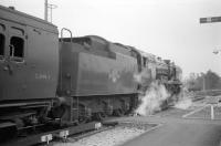 Bulleid <I>West Country</I> Pacific no 34025 <i>Whimple</i> stands at the head of the LCGB <I>Hampshire Branch Lines Rail Tour</I> at Ascot station on 9 April 1967.  The Pacific had brought in the special from Brockenhurst and was about to hand over to BR Standard class 4 2-6-0 no 76031, which would handle the next leg as far as Aldershot [see image 27445].<br><br>[Robin Barbour Collection (Courtesy Bruce McCartney) 09/04/1967]