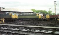 An interesting mix of diesel motive power stands in the yard at Ferryhill MPD in April 1974. From left to right are 26011, an unidentified Class 47 and 24118.<br>
<br><br>[John McIntyre /04/1974]