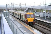 The westbound platform at Blackridge on 13 January 2011, with the last of the snow being washed away by rain. The train is the 11.57 to Helensburgh Central (11.21 ex-Waverley) formed by SPT liveried 334007.<br><br>[John Furnevel 13/01/2011]