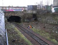 It is over 80 years since anyone caught a train at Leith Walk station. I imagine it succumbed to competition from the frequent trams up 'The Walk' as passenger trains continued to pass it on the way to the North Leith branch which didn't close until 1947 on the eve of nationlisation. The ticket office was set back from Leith Walk where these advertising hoardings now stand [see image 22889]. <br><br>[David Panton 15/01/2011]