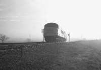 D192 with train 1S65 the 3.38pm from Carlisle (8.50am ex-St Pancras) illuminated by a weak winter sun on 21 December 1968.  The train is about to cross the bridge over the WCML at the the south end of Kingmoor yard on its way to Edinburgh via the Waverley route.<br><br>[K A Gray 21/12/1968]