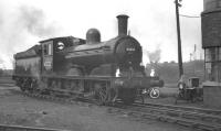 Smart looking class J21 0-6-0 no 65033 photographed alongside the shedmaster's office at Darlington. The occasion is the RCTS/S&DLS <I>J21 Railtour</I> of 7 May 1960 involving a return trip to Carlisle via the Stainmore route.<br><br>[K A Gray 07/05/1960]