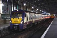 334012 at Platform 15 of Glasgow Central waiting to depart for Ayr on 6 January. It is still in a rubbed down, partial liveried state and is being used due to a shortage of available units<br><br>[Graham Morgan 06/01/2011]