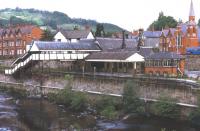 The pre-restoration station at Llangollen in early June 1974. It appears in remarkably goodcondition considering that passenger services between Ruabon and BalaJunction had been withdrawn in December 1964, although freight continued toLlangollen from Ruabon until 1968 [see image 36877].<br>
<br><br>[Bill Jamieson /06/1974]