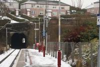 Looking towards Port Glasgow from Whinhill on a snowy 12th January 2011. The redundant second Cartsburn Tunnel is out of sight to the right of picture behind the vegetation [see image 9583].<br><br>[Graham Morgan 12/01/2011]