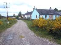 Looking north along the trackbed at Nethy Bridge towards Grantown-on-Spey in May 2002. The station, which had closed to passengers in 1965, was in use as a hostel.<br><br>[John Furnevel 15/05/2002]