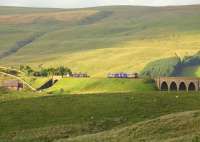 Looking towards Dandry Mire Viaduct on the Settle and Carlisle line on 14 July 2010. A Northern class 156 DMU heads north with an afternoon service from Leeds destined for Carlisle.<br><br>[Ian Dinmore 14/07/2010]