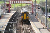 A lone passenger on the platform at Curriehill on a Wednesday morning in February 2008 about to board an afternoon  Glasgow Central - Edinburgh Waverley (via Shotts) service.<br><br>[John Furnevel 27/02/2008]