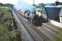 BR Standard class 4 2-6-0 no 76095 takes a train north through Lochside on 22 August 1959. (The station reopened in 1966 and was renamed Lochwinnoch in 1985.) <br>
<br><br>[A Snapper (Courtesy Bruce McCartney) 22/08/1959]