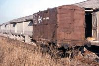The once-ubiquitous old-style wooden BR container (in this case conveying biscuits from the south) standing in the Needlefield warehouse siding, Inverness, in 1974.<br>
<br><br>[David Spaven //1974]