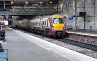 The novelty of 334s in Edinburgh will soon wear off, but for now the <br>
livery and the strident digital ping of the door warning are things of the west.334 036 at Platform 10 will form the 1321 to Helensburgh Central. For now there are enough sets on a Saturday (as here) to provide a half-hourly service. The cascade following the gradual introduction of problematic 380s means that (when last I heard) the full 4 trains an hour Monday to Saturday service will not start until the May timetable change at the earliest.<br><br>[David Panton 22/01/2011]