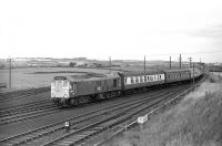 One of the many Summer Saturday arrivals at Filey Holiday Camp in 1970. Train 1H31, the 08.35 from Wakefield Kirkgate is about to enter the station behind 5180 on 15 August, some 7 years before closure.<br><br>[Bill Jamieson 15/08/1970]