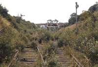 View south over Prospect Hill Junction, Whitby, on 21 August 1971 with West Cliff station behind the camera. On the left is the former coast route to Scarborough while running off to the right is the steeply graded (1 in 50) connection down to Bog Hall Junction and Whitby Town station. The Whitby Town - West Cliff - Scarborough service had been withdrawn more than six years earlier in March 1965. [See image 28894]<br>
<br><br>[Bill Jamieson 21/08/1971]