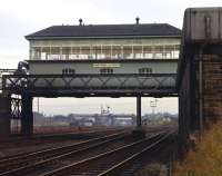 Portobello East signalboxseen here from the west in November 1970 with the ECML disappearing straight ahead under the by then redundant plate girder bridge carrying the Lothian Lines. Beyond is the masonryarch underBrunstane Road at the west end of what had been Joppa Station. The former Waverley Route, devoid of passenger traffic in 1970 but still busy with freight to and from Millerhill Yard, diverges to the right behind the stone built base for the water tank.<br><br>[Bill Jamieson 22/11/1970]