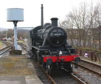 Ivatt class 2MT 2-6-0 no 46443 takes water at Rawtenstall on 23 <br>
January 2011. Rawtenstall West signal box, located alongside the level crossing, can be seen beyond the water tower.<br><br>[John McIntyre 23/01/2011]