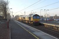 66422+66411 <I>'Eddie the Engine'</I> on the 6M22 Hunterston flasks heading south through Uddingston on 21 January 2011.<br><br>[Ken Browne 21/01/2011]