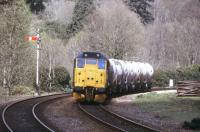 A class 31 with cement empties from Barnstaple to Westbury photographed at Eggesford in March 1986.<br><br>[Ian Dinmore /03/1986]