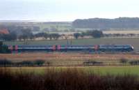 An <I>'East Coast'</I> train heads south through the Northumberland countryside near Boulmer on the approach to Alnmouth on the afternoon of 23 January 2011.<br><br>[John Steven 23/01/2011]