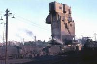 1968 view of Carnforth MPD, with 8F 48324 and 5MT 45226 on one of the coaling roads. View from the west side of the shed with the town in the background. [See image 32541]<br><br>[David Hindle //1968]