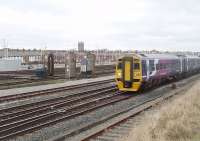 The carriage sidings at Blackpool North normally stand empty during the day, although many DMUs are serviced there overnight between duties. 158754 is about to enter Blackpool North station with a service from York on 27 January, passing the deserted sidings and carriage washing plant.<br><br>[Mark Bartlett 27/01/2011]