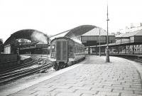 An Ayrshire-bound InterCity DMU leaving from one of the platforms on the extension side of St Enoch in June 1966.<br><br>[Colin Miller /06/1966]