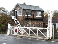 The rustic old signal box alongside the A684 level crossing in Bedale on what is now the Wensleydale Railway. Photographed in October 2004 looking towards Leyburn. <br><br>[John Furnevel 31/10/2004]