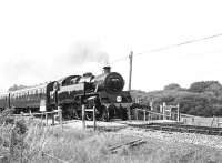 Standard class 4 no 80078 with a train on the Swanage Railway, near Corfe Castle, on 29 June 2000.<br>
<br>
<br><br>[Peter Todd 29/06/2000]