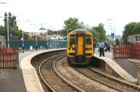 A Northern service from Blackpool North to York calling at the East <br>
Lancashire station and former junction at Accrington on 29 July 2010. The view is to the west and the platforms of the line through Helmshore and Haslingden towards Bury and Manchester once stood over to the left.<br>
<br><br>[John McIntyre 29/07/2010]