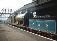 NB 256 <I>Glen Douglas</I> coupled to CR 123 backing out of Glasgow Central station on 5 September 1959. The pair had arrived earlier in the day with one of the specials arranged to bring visitors to the <I>Scottish Industries Exhibition</I> being staged in Glasgow at that time. [See image 32057]<br><br>[A Snapper (Courtesy Bruce McCartney) 05/09/1959]