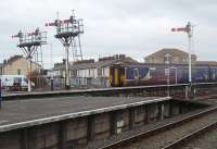 A Northern local service arrives at Blackpool North. 156486 runs in past the bracket semaphores on the ends of the platforms. Resignalling has been proposed for years now but the planned electrification will probably see these signals, and Blackpool North No. 2 box, finally replaced. <br><br>[Mark Bartlett 27/01/2011]