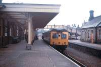 Platform scene at Llandrindod Wells on the Central Wales Line in the summer of 1971 - before the crossing loop was returned to the platform road opposite.<br>
<br><br>[David Spaven //1971]