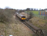 314 205 waits in the reversing stub at Neilston on 5 February before re-entering the station (formerly known as Neilston High) to return to Glasgow. The line once continued behind the camera to join the G&SWR main line at Lugton. <br>
<br><br>[David Panton 05/02/2011]