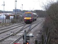 On 5 February 170 477 eases out of the siding at Cumbernauld after <br>
changing ends for the return to Glasgow Queen Street. For the size of the town Cumbernauld station never seems particularly busy. In fact the per capita bookings are exceptionally low: about 6 tickets sold per resident per year. This is half the figure for the comparable New Town of East Kilbride with its single-platform terminus. The figure for Kirkcaldy, another similarly sized town, is over 20. Cumbernauld's low usage must have a lot to do with the fact that the station is not conveniently placed for most of the town (Croy station is nearer to some communities). There are also frequent express bus services to Glasgow from the town centre.<br>
<br><br>[David Panton 05/02/2011]